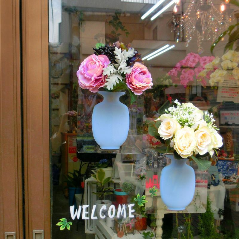 This is a removable silicone vase that can stick to any flat surface