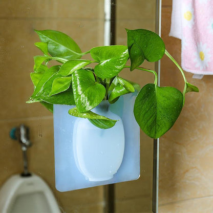 This is a removable silicone vase that can stick to any flat surface