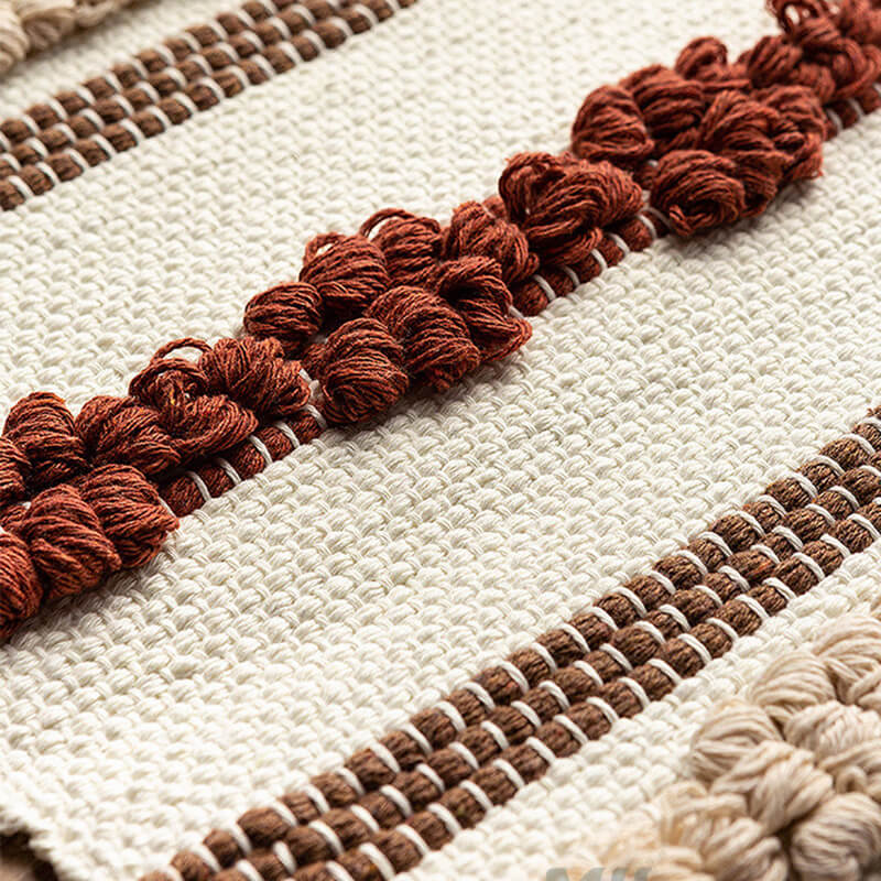 Tenture murale à pompons en jacquard Lighteme